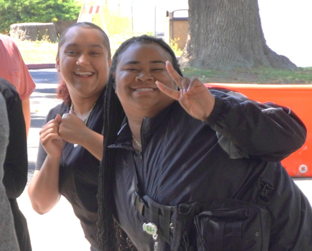 Two staff members smiling at CIM in Chino.