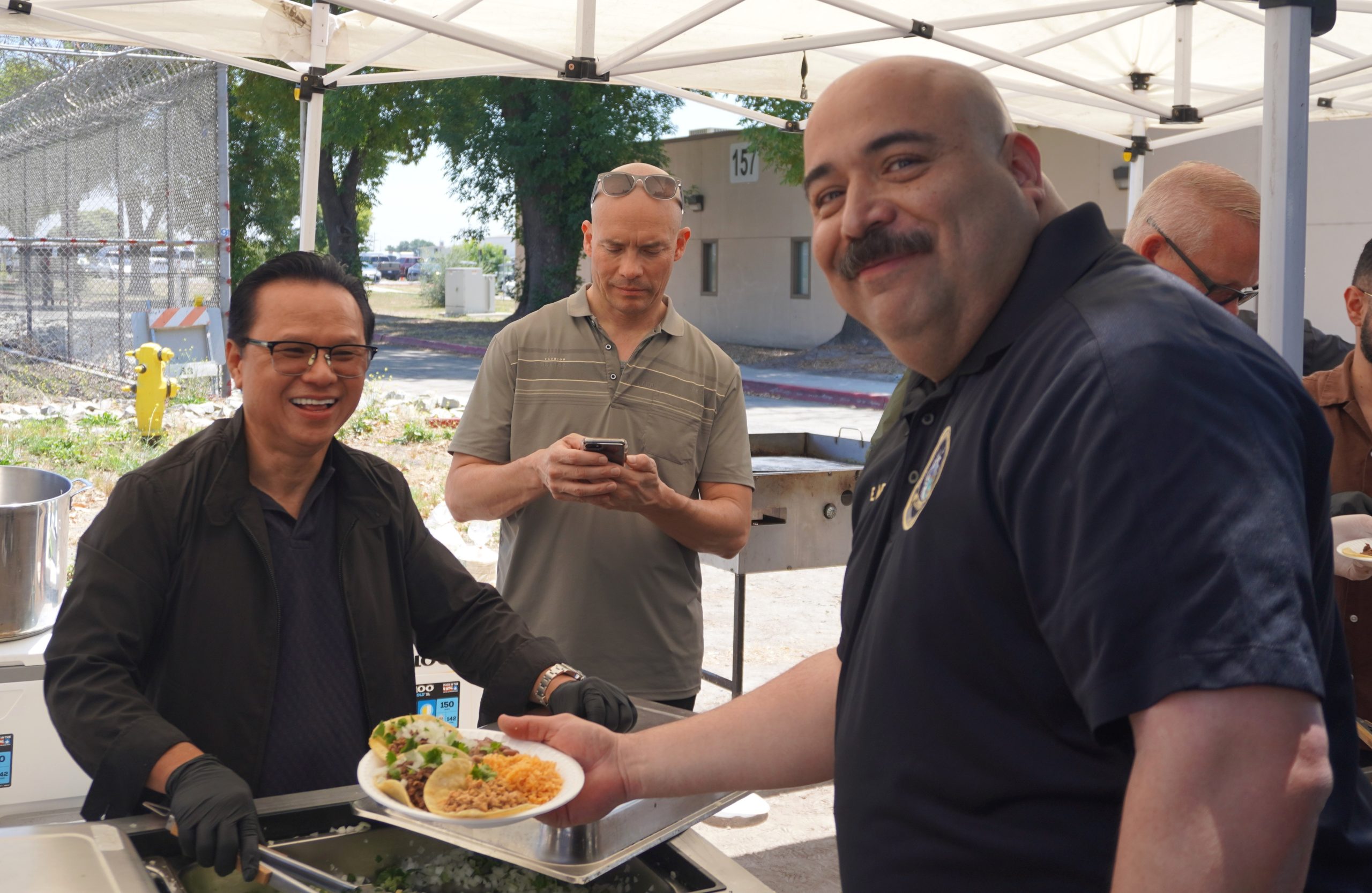 Warden gets a plate of food at the CIM staff appreciation event in May 2026.