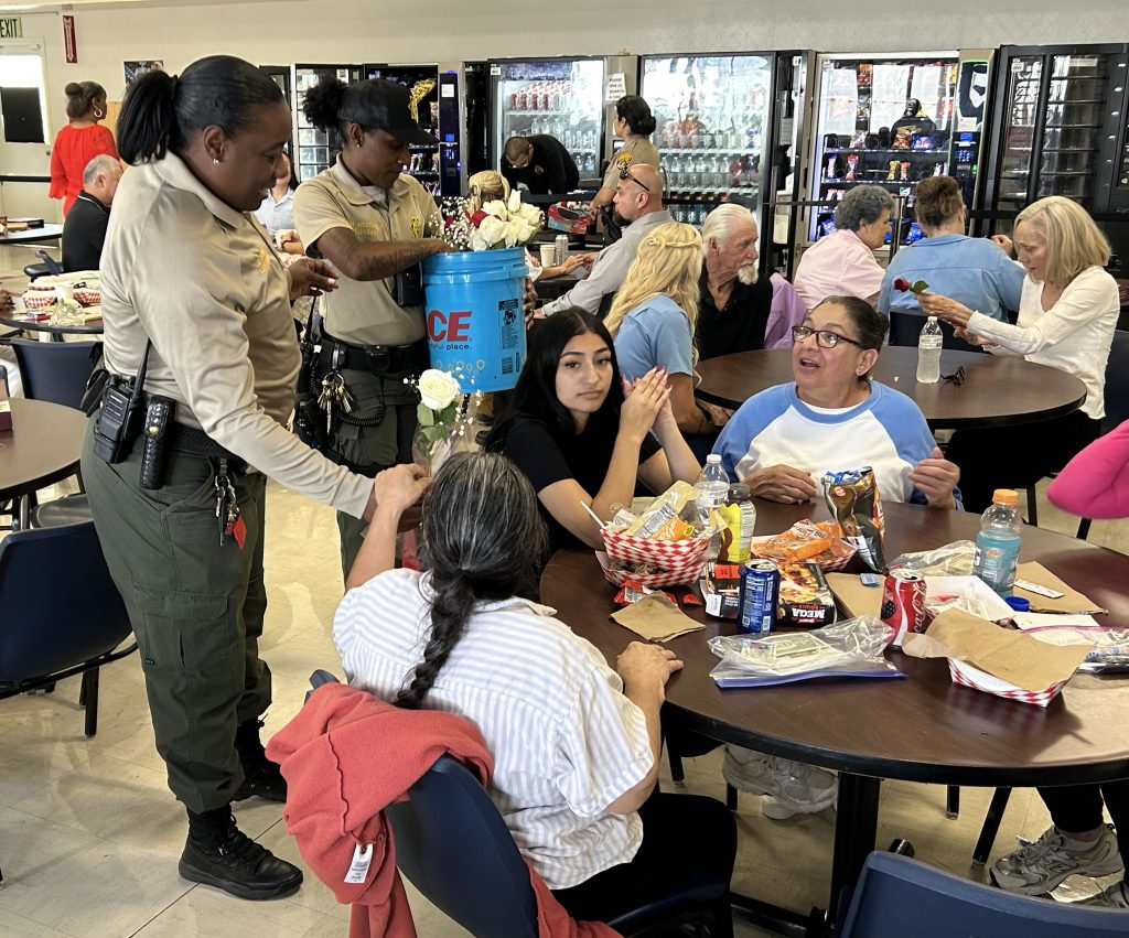 Group of families and incarcerated women at CIW during Mother's Day visiting.