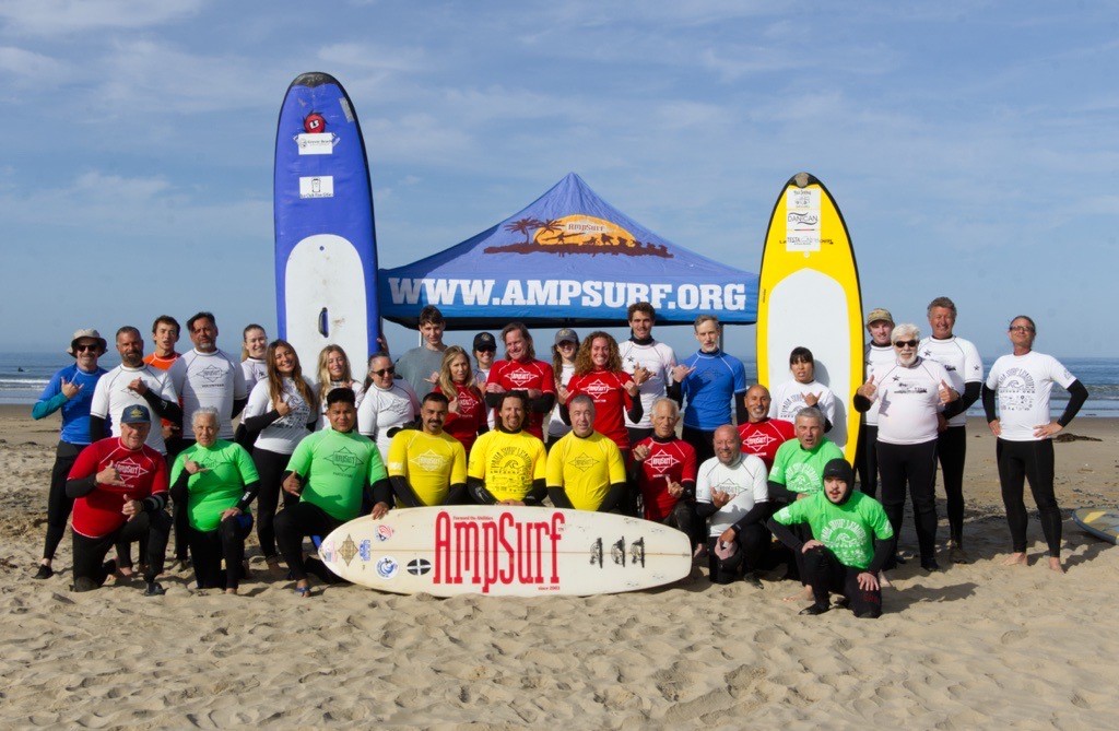 Group photo of CMC staff, volunteers, and the community at an adaptive surf therapy clinic held April 18 at Pismo Beach, California.