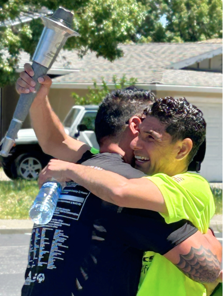 Participants embrace at the 2026 Law Enforcement Torch Run