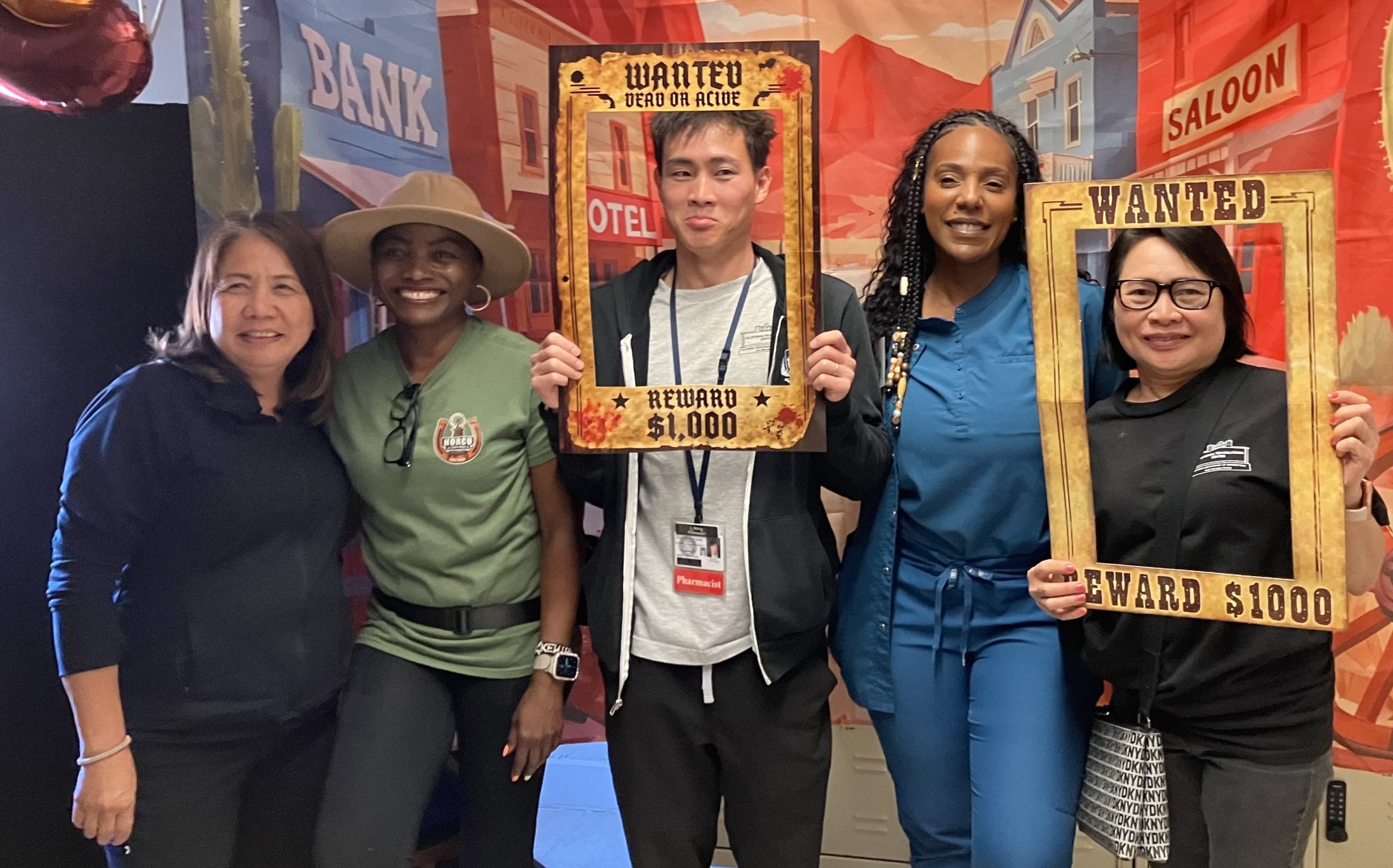 CRC Last Rodeo for Nurses Week with four staff members posing for a photo against an Old West themed backdrop.