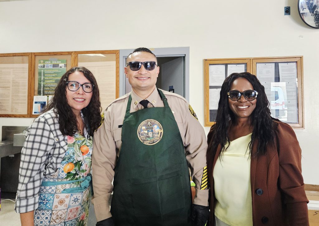 Three people at Centinela State Prison during a staff appreciation event.