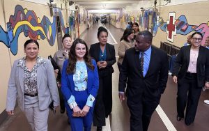 CTF-Soledad Undersecretary Johnson tours CTF-Soledad. He's shown walking down a hallway with other CDCR and prison staff.