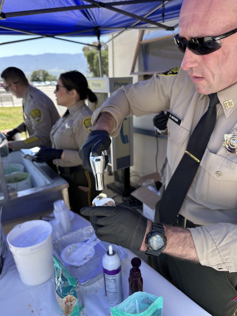 Staff serve ice cream to CTF employees.