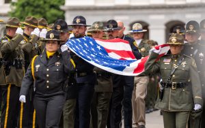 Honor guards from CDCR and other agencies carry the flag at the California Peace Officers Memorial May 4 at the Capitol in Sacramento.