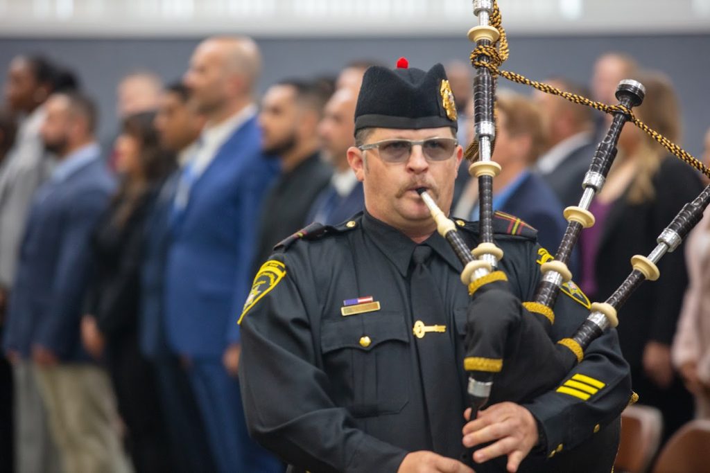 Bagpipes were played at the opening of the parole agent graduation ceremony.