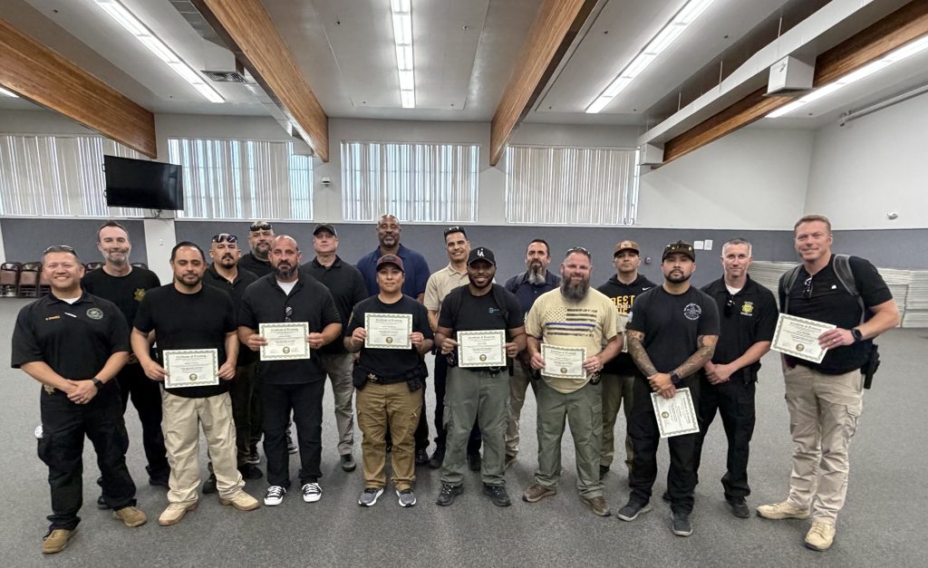 Special agents holding their training certificates.