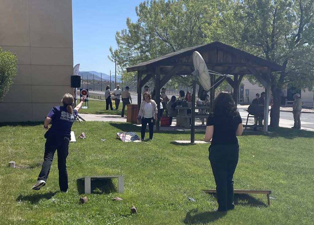 People play a beanbag tossing game at High Desert State Prison in Susanville, California.