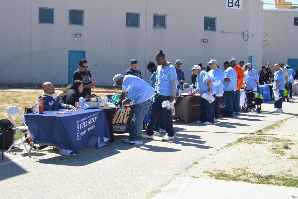 LAC pathway to progress event with many incarcerated and staff at booths