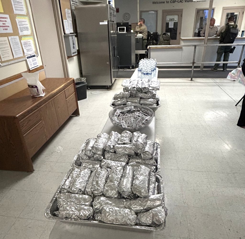 A line of breakfast burritos at CSP-Los Angeles County.