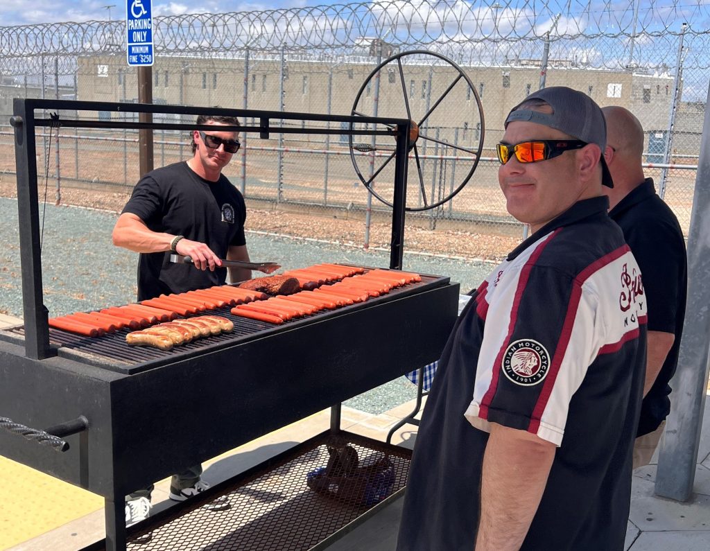 Grilling burgers and hotdogs at Mule Creek State Prison, Ione, California, May 2026.