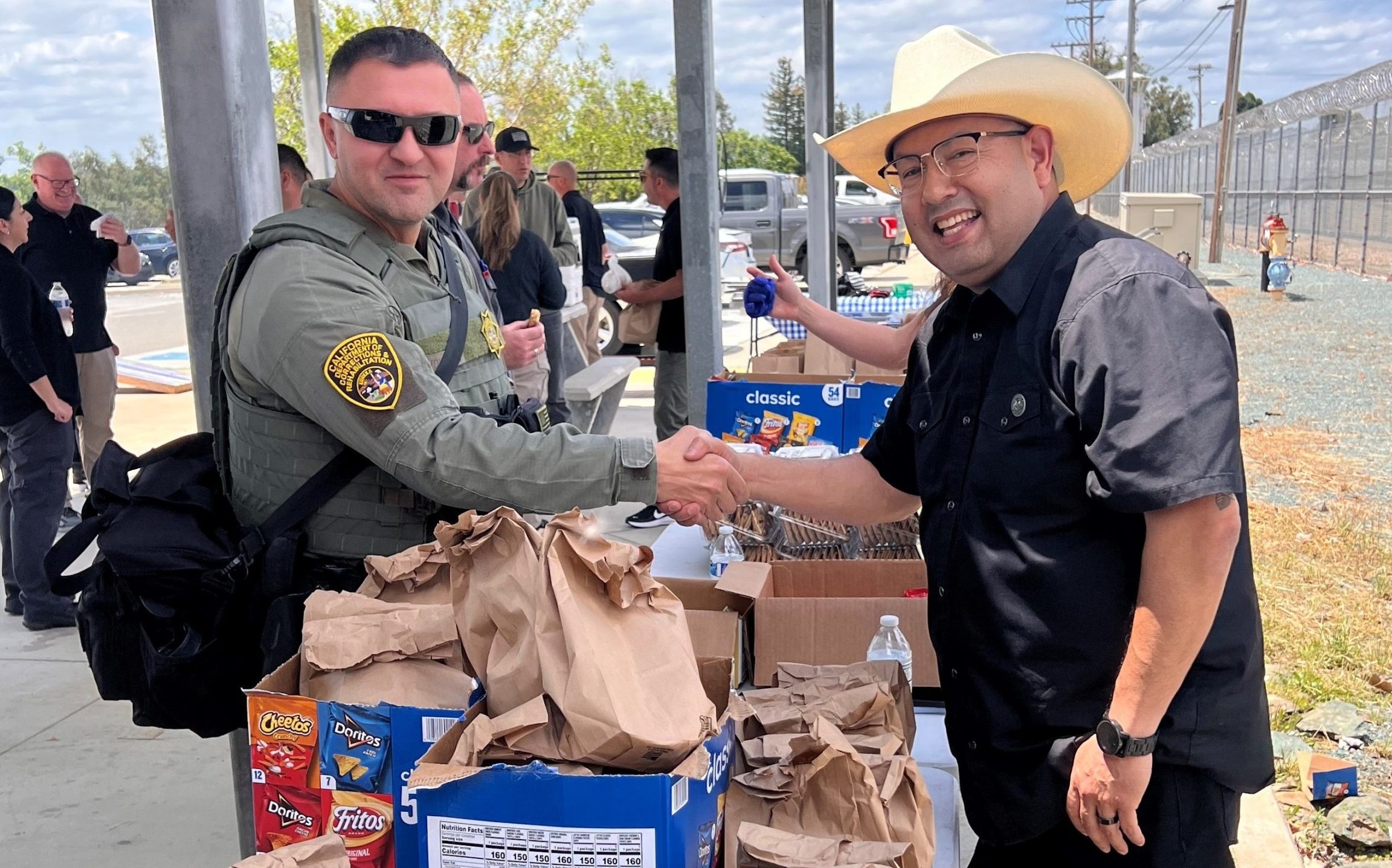 Shaking hands with staff members at Mule Creek State Prison in Ione, California, for an appreciation event.