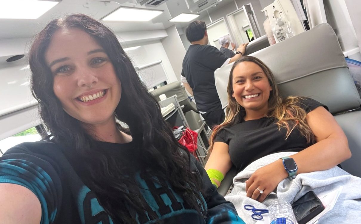 Two Mule Creek State Prison staff members are all smile after donating blood with Vitalant.
