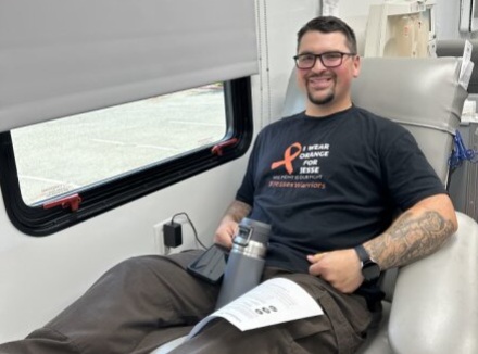 A male staff member prepares to donate blood at Mule Creek State Prison.