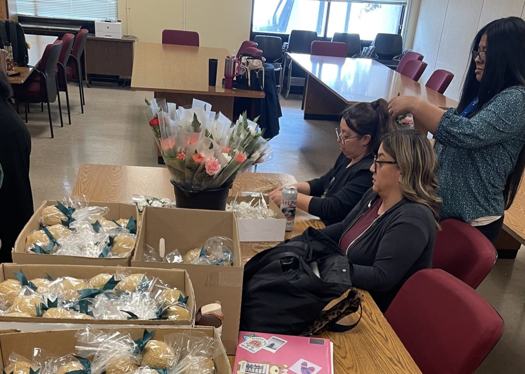 Staff creates packages of flowers and treats at North Kern State Prison.