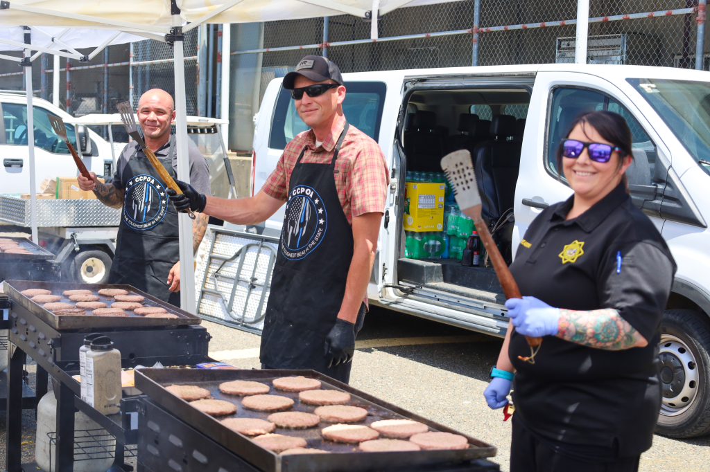 Staff working the grill at CSP-Sacramento.