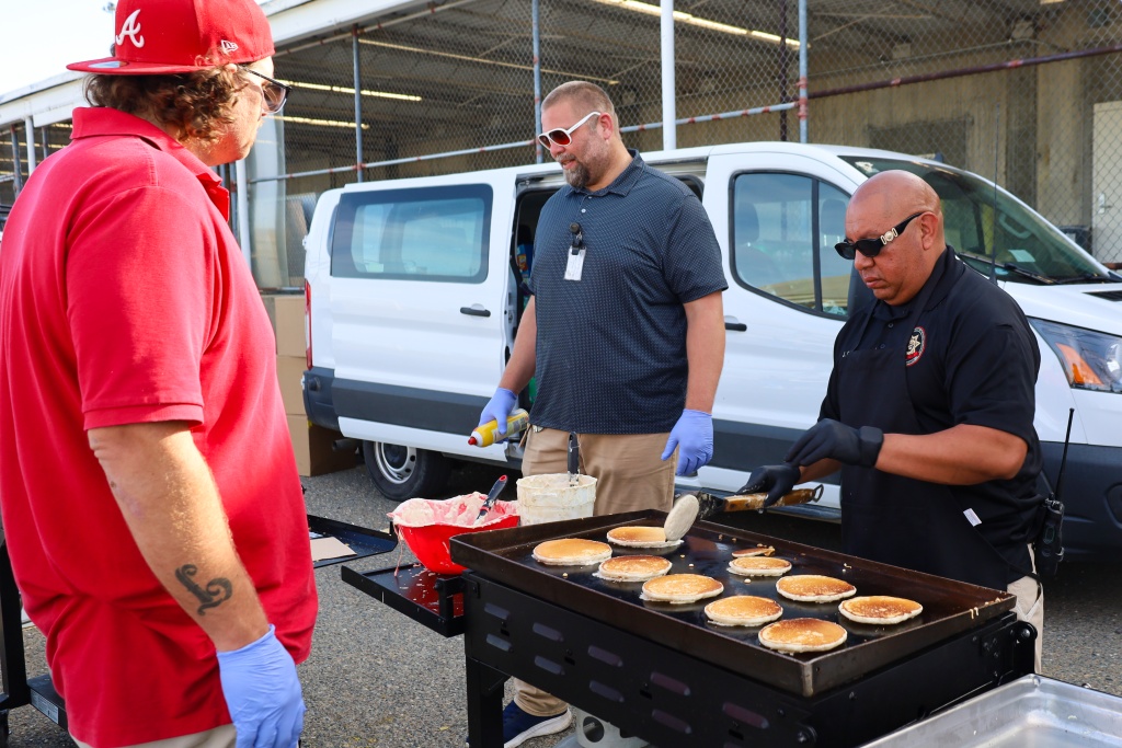 Cooking pancakes at CSP-Sacramento for staff appreciation.