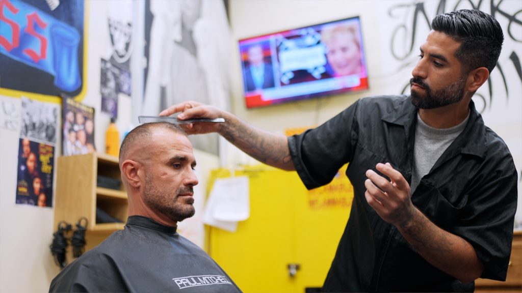 Incarcerated barber cuts hair at SATF in Corcoran, California.