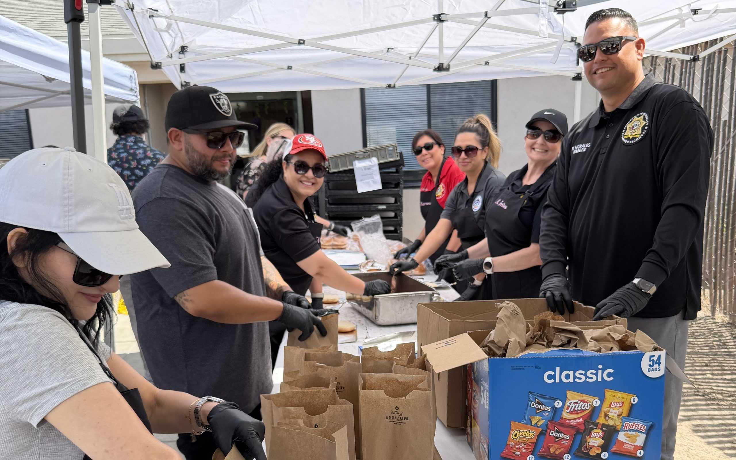 Warden and managers at SATF pack lunches for staff appreciation week.
