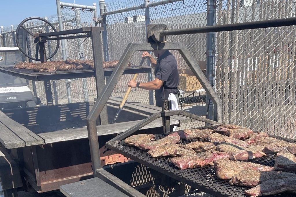 Managers grill 800 pounds of tri-tip during an appreciation event at SATF.