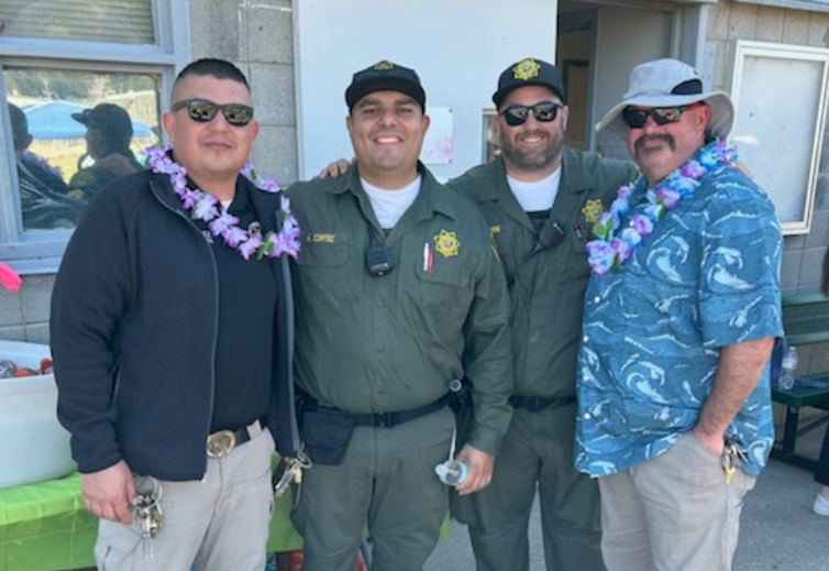Group wearing Hawaiian shirts and leis at CSP-Solano.
