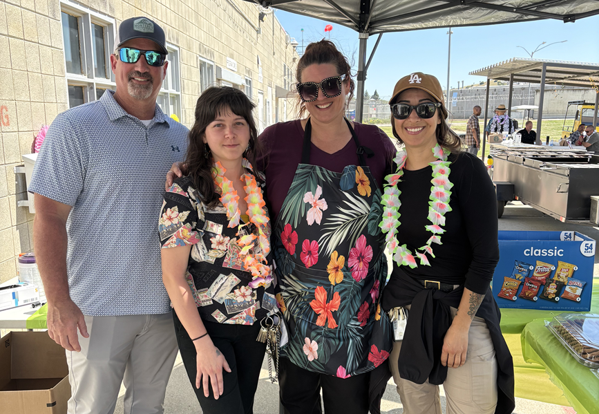 Staff members wear Hawaiian leis at CSP-Solano.