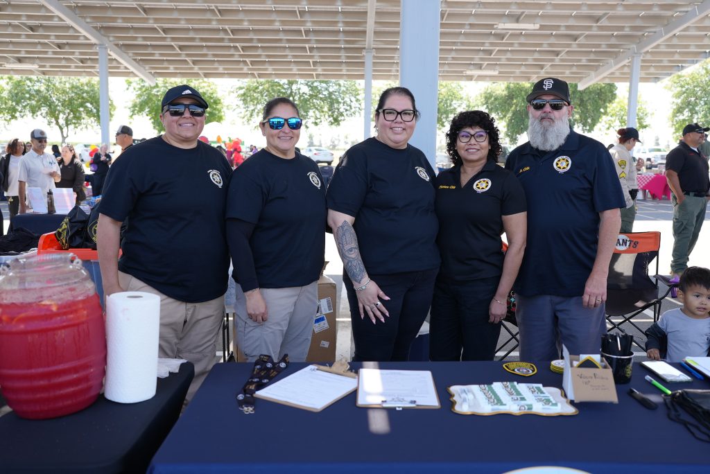 Group photo of people wearing black shirts at Valley State Prison event.