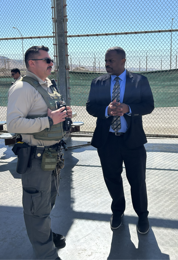 Undersecretary Johnson speaking to SVSP staff member in uniform