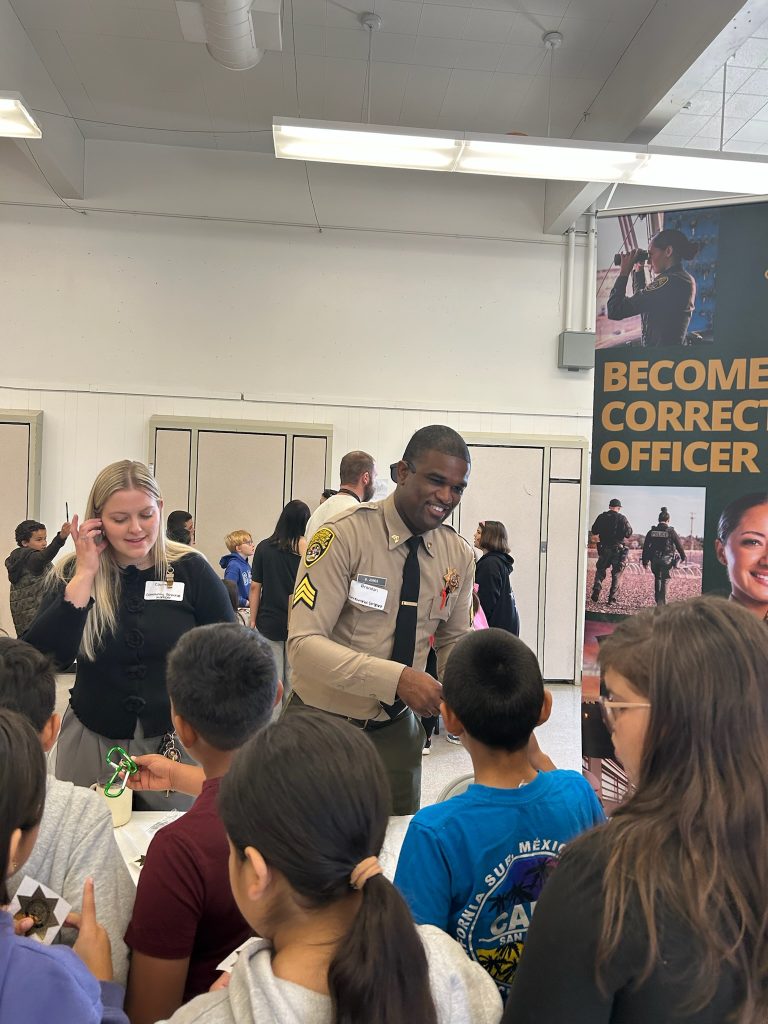 CMF staff speak to children at school career day