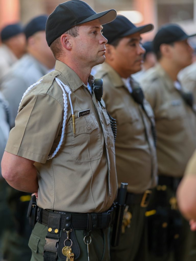 Cadets in a line wearing their uniforms.