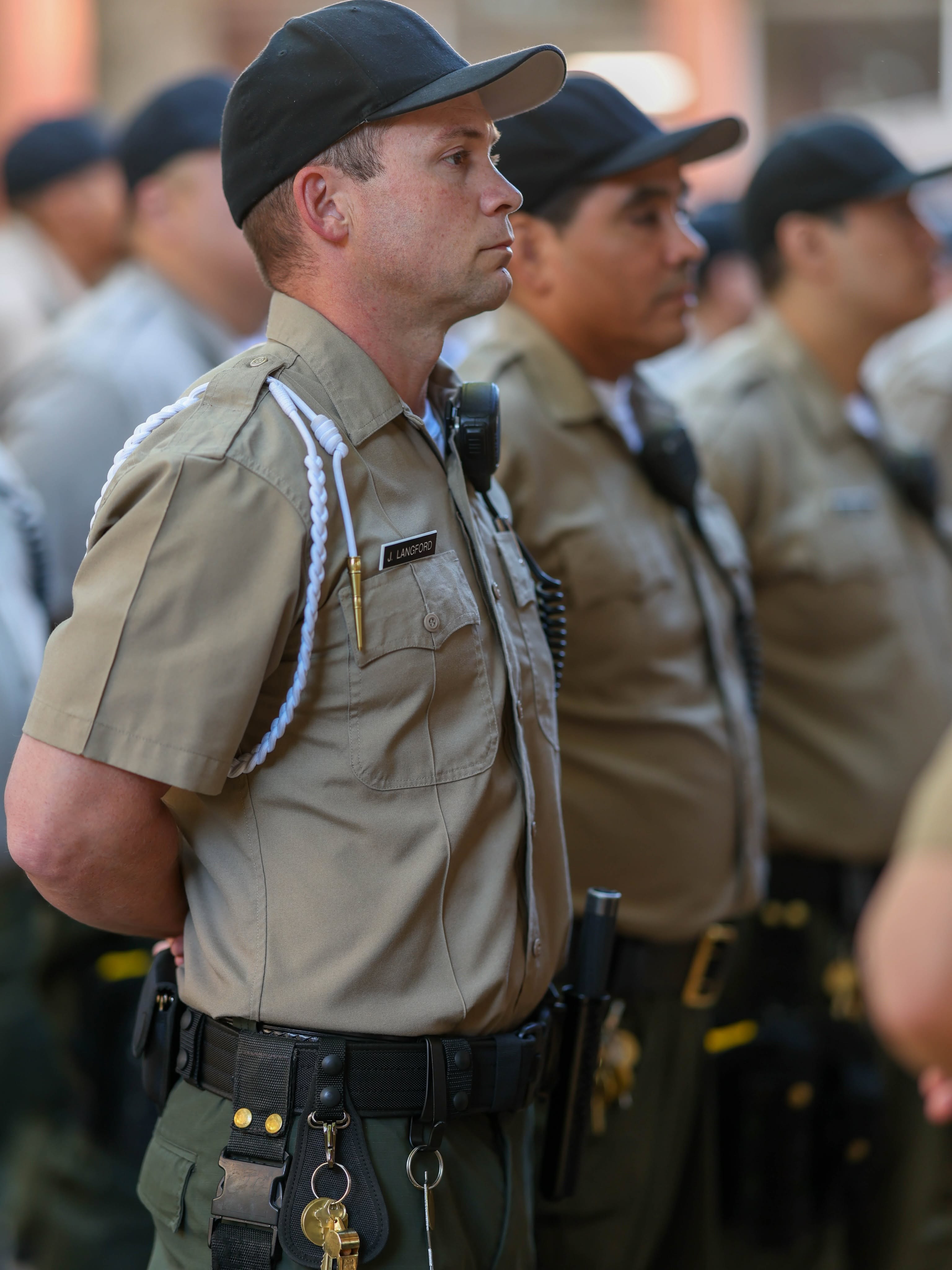 Cadets in a line wearing their uniforms.