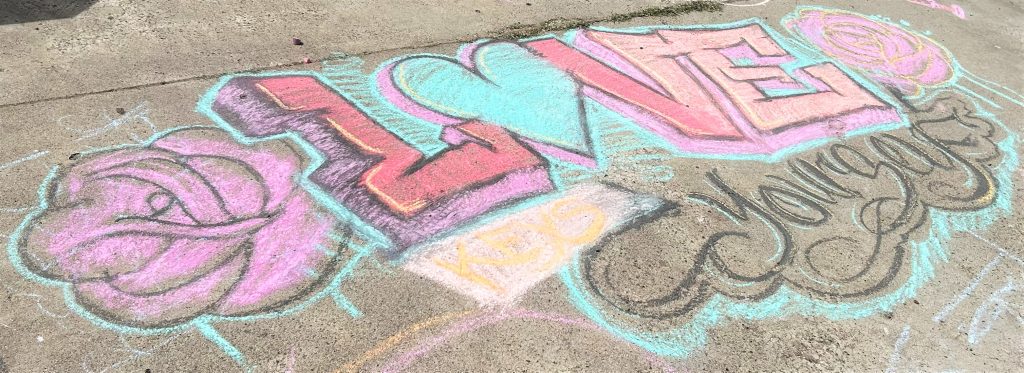 SCC mental Health awareness, sidewalk chalk artwork reading "Love Yourself"