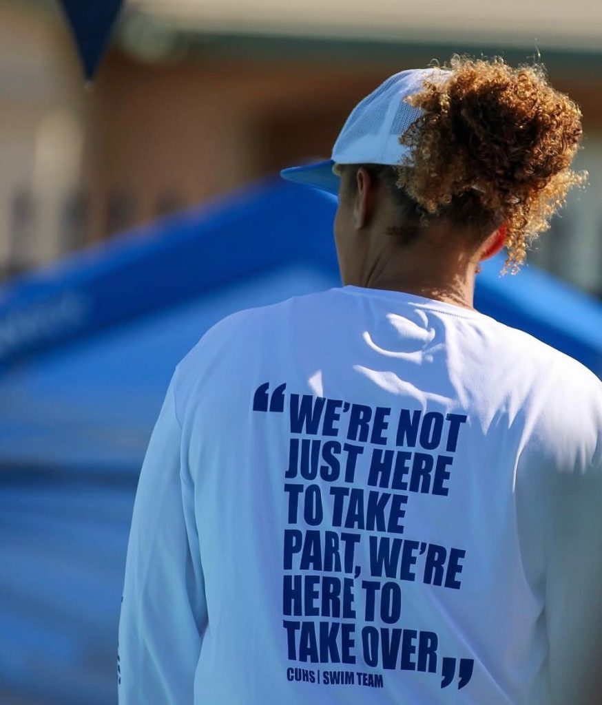 Coach Duarte with an inspiration quote on the back of her t-shirt.