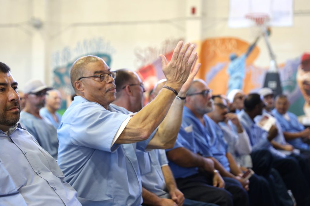 Other incarcerated people cheer on the graduates at CSP-Solano.
