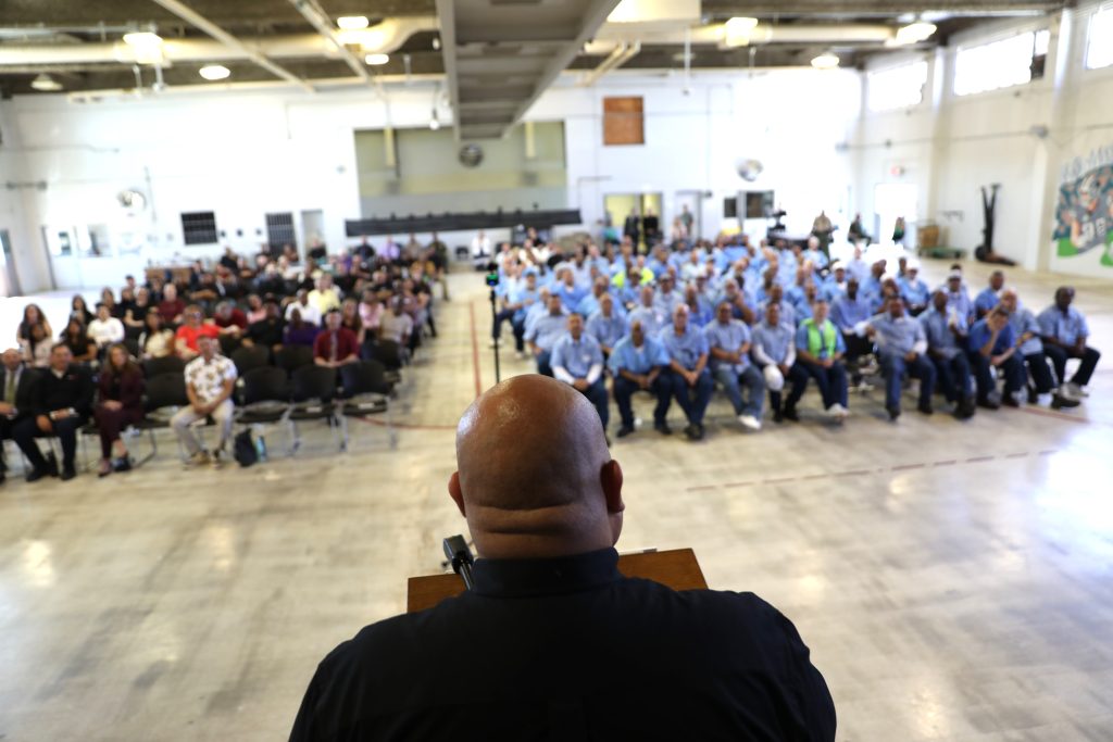 A speaker at the lectern in CSP-Solano for the graduation ceremony at CSP-Solano.