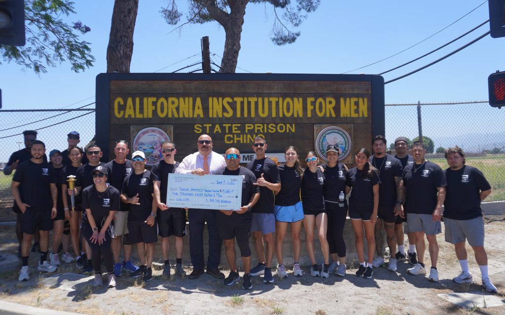 CIM and CIW staff presented a check to Special Olympics during the Law Enforcement Torch Run.