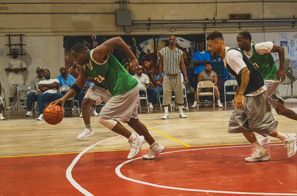 Players run across the court during the CIM tournament.