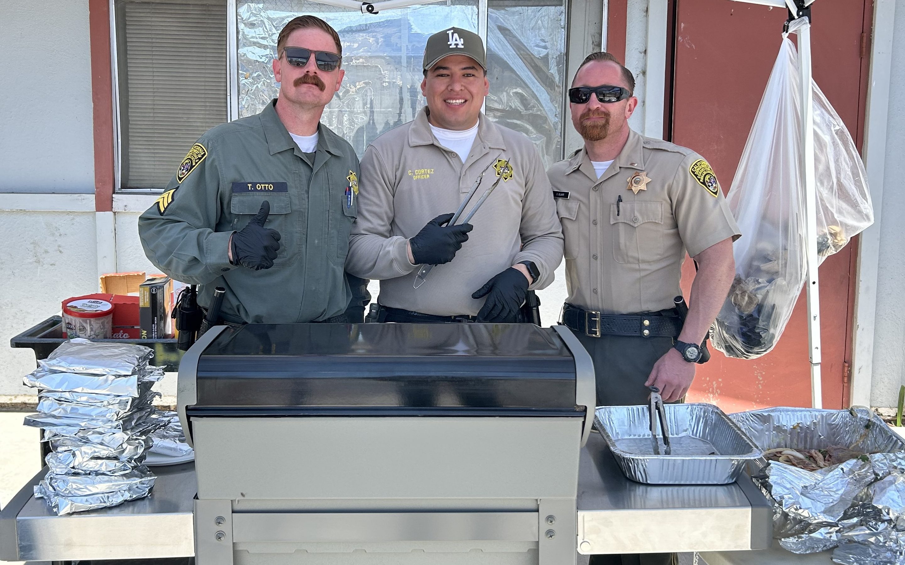 Staff work the barbecue grill during Father's Day visiting 2026 at CIW in Corona, California.