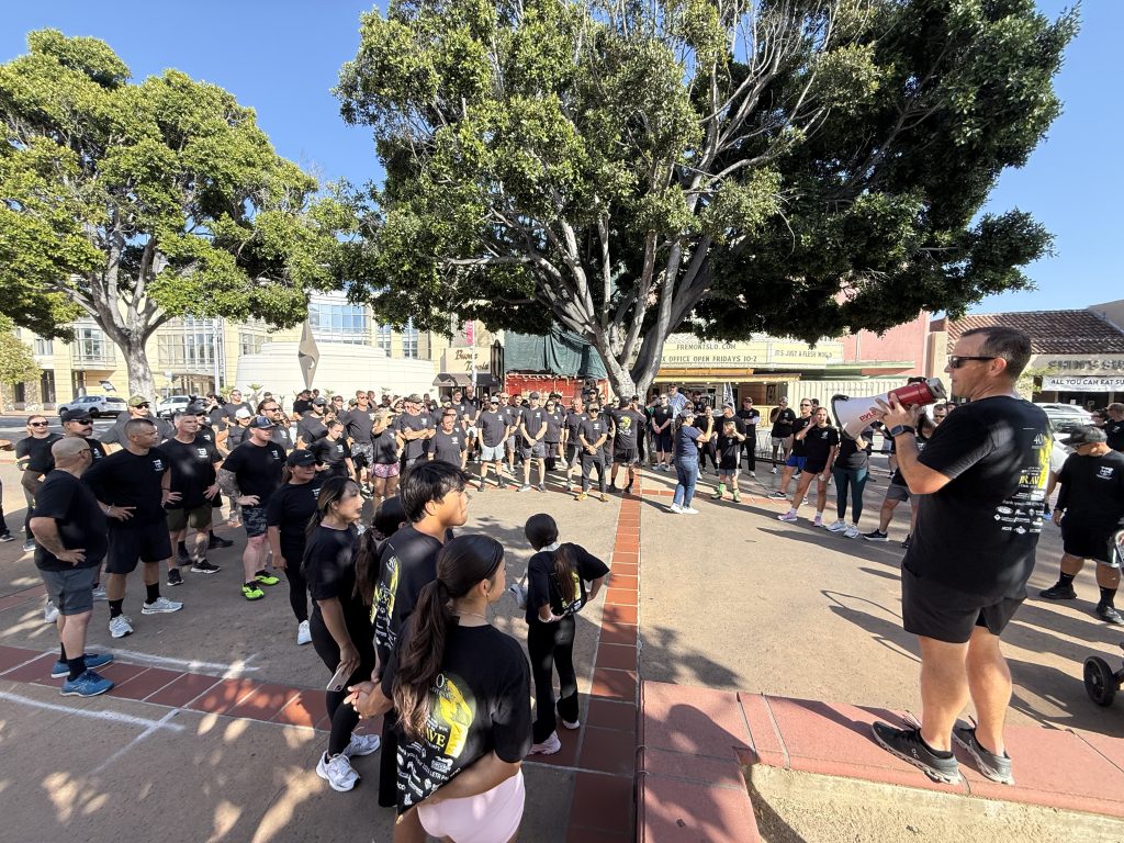 Rallying the runners at the Torch Run with California Men's Colony.