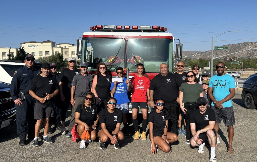 Group in front of a fire engine during the CRC-Norco Law Enforcement Torch Run 2026.