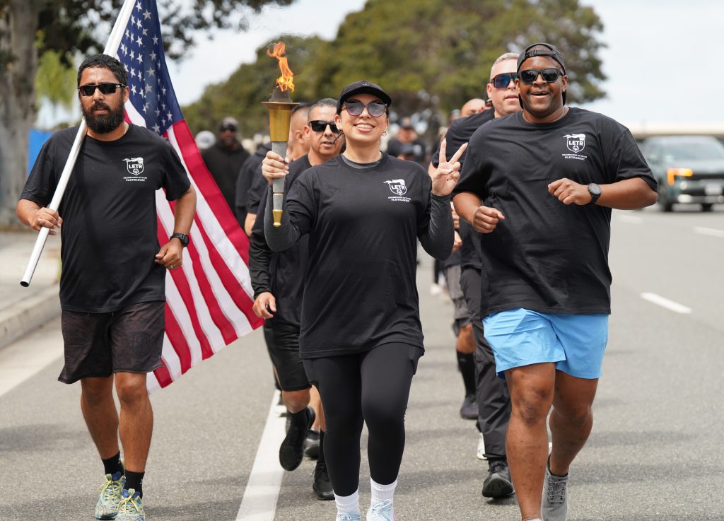 Parole staff in the southern region carry the torch for Special Olympics.