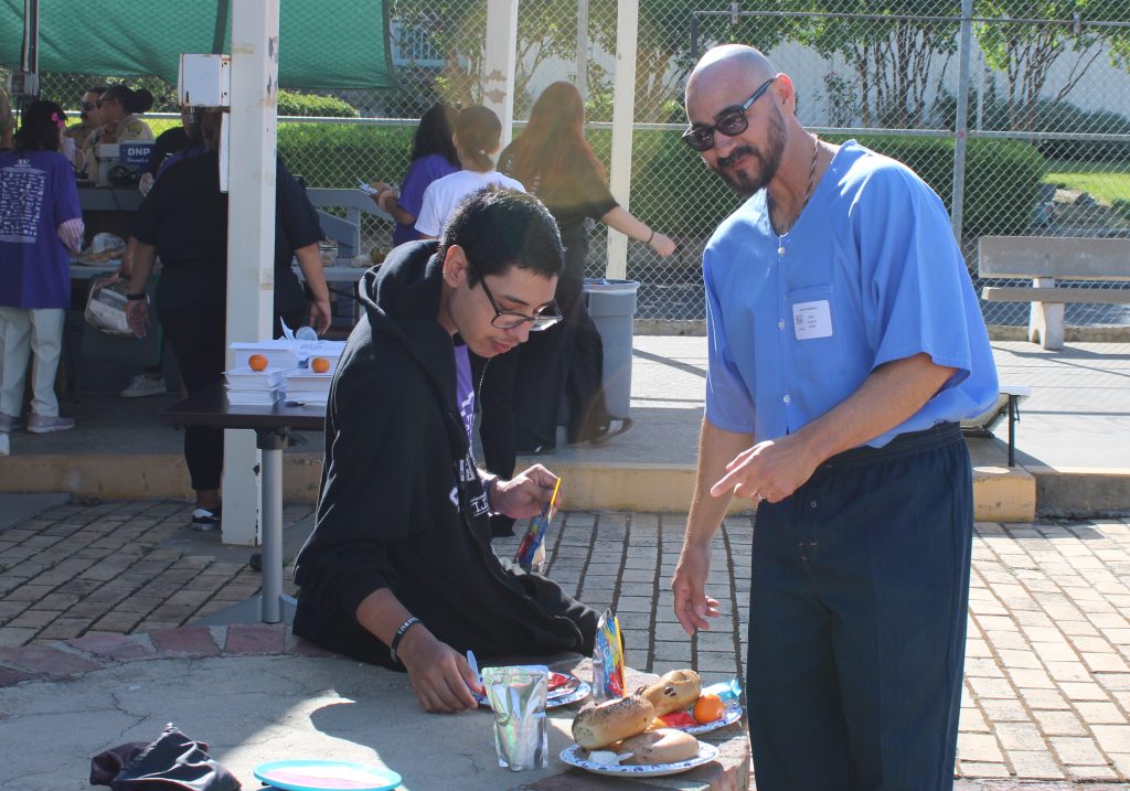 Enjoying lunch during Get on the Bus at Folsom State Prison.