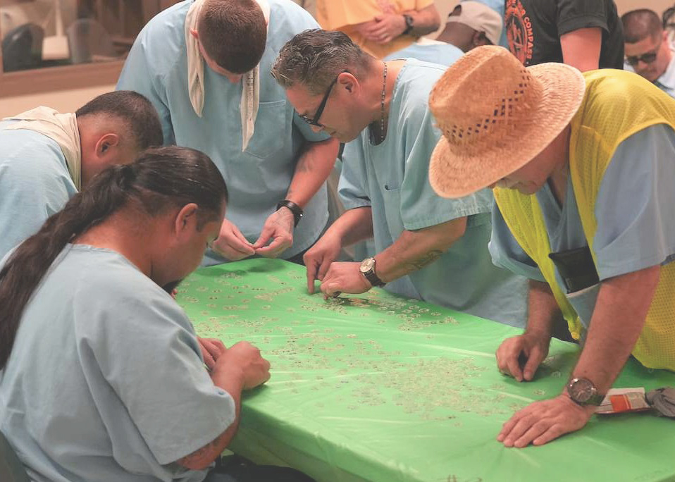 Impossible Puzzle Competition group at work on puzzle