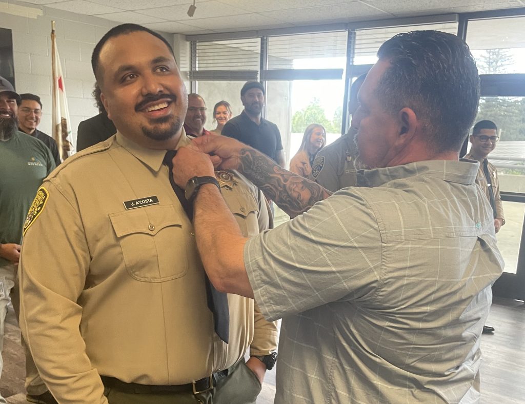A staff member received his rank insignia at CSP-Sacramento.