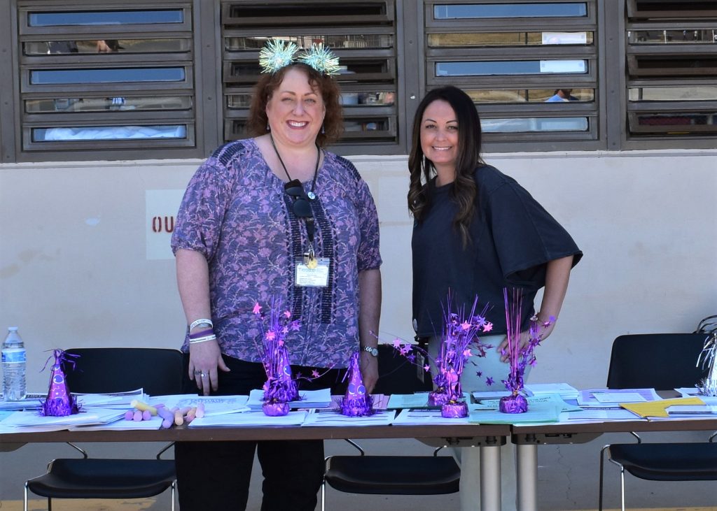 SCC staff at information table for metal health and suicide prevention awareness event