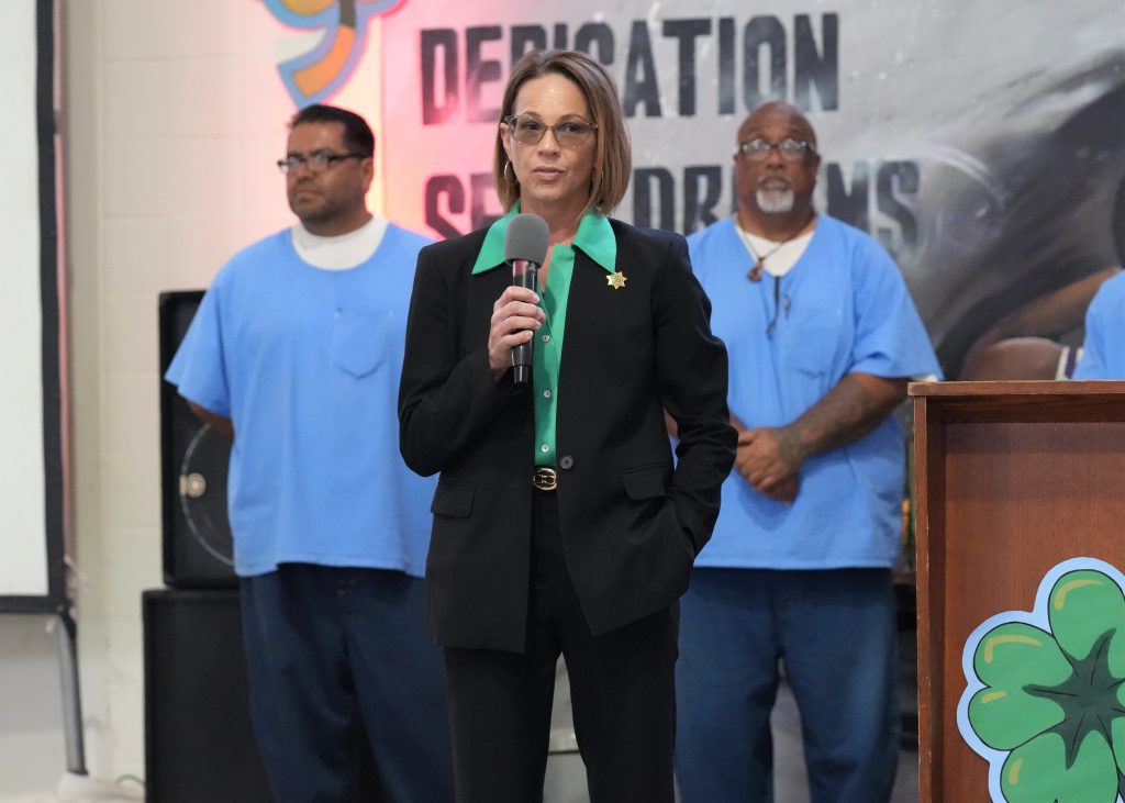 Division of Adult Institutions Director Gena Jones speaking at Clover Awards ceremony