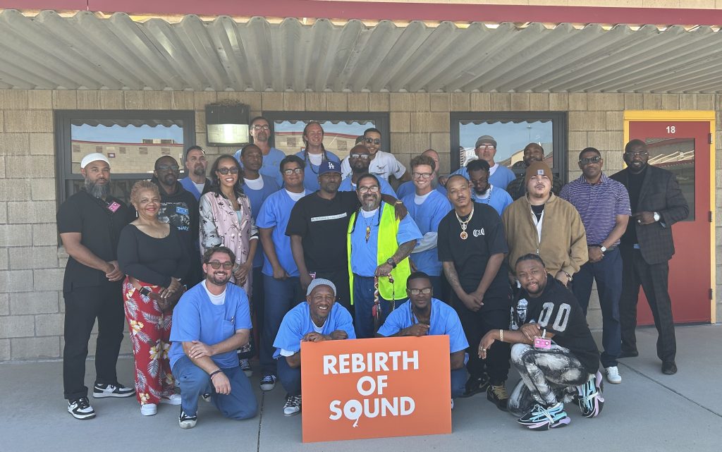 Group photo of program providers and participants in Bars to Beats at Valley State Prison in Chowchilla.
