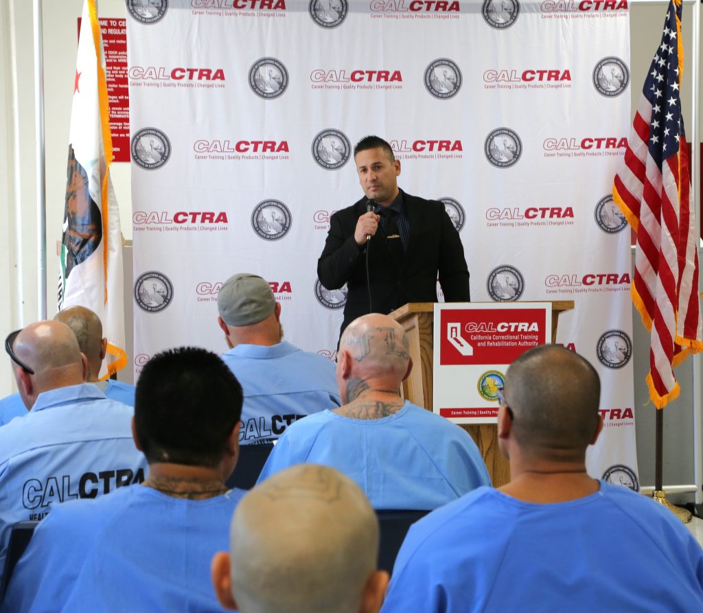 Centinela Chief Deputy Warden Black speaks at the graduation.