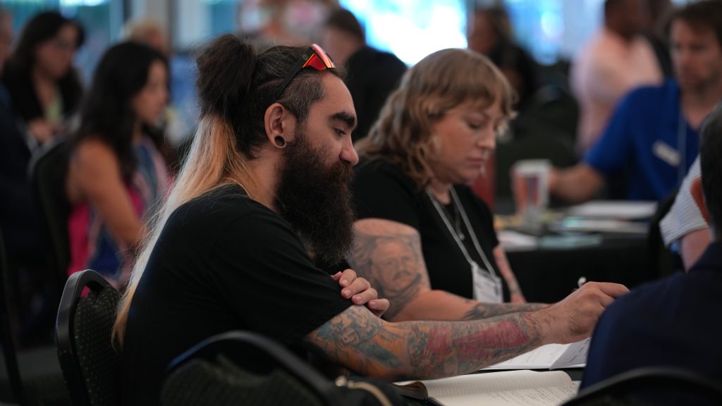 People learn about how to handle their grants during a recent summit.
